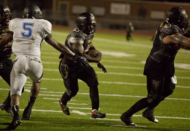 Ramell Watts runs for the Cobras second touchdown of the night.