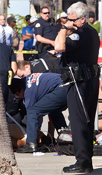 Firefighters perform CPR on a man shot by an Oceanside Police Officer at the Oceanside Harbor