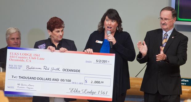 Carole May with the Oceanside Elks presents Eileen Turk, Parks and Recreation Division Manager , with a $2,000.00 donation 