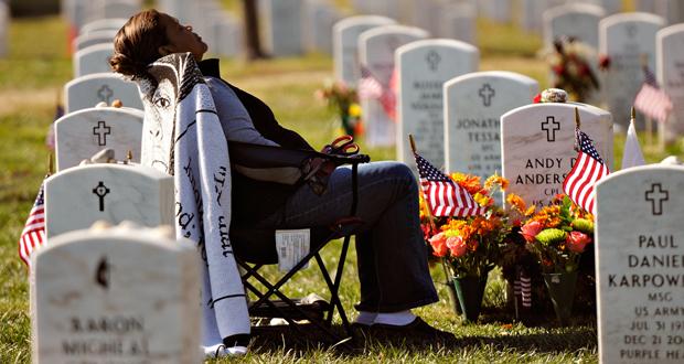 Xiomara Mena Anderson of Falls Church, Va., visits her son, Army Cpl. Andy Anderson, in Section 60 on Veterans Day 2013. Cpl. Anderson died in Ramadi, Iraq on June 6, 2006. (Photo courtesy of Military Times)