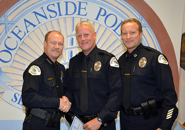 Chief McCoy welcomes Officer, Mike Hatfield with Captain Bechler