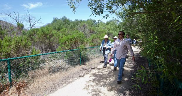 A+group+walks+along+the+LaCosta+Glen+Trail+which+borders+the+new+preserve+area