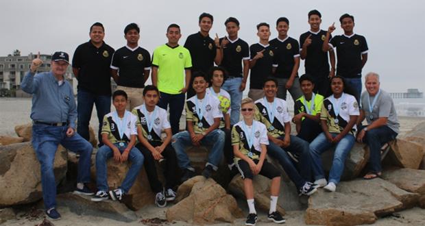 Top row from left to right: Coach Francisco Flores, Jose Casarrubias, Osbaldo Arguelles, Tony Ramirez, Francisco Zendejas, Conrado Barahona, Diego Garcia, Miguel Arango, and Isait Gonzalez (Angel Villalobos missing).
Bottom row from left to right: Oceanside Mayor Jim Wood, Juan Nava, Eiko Rodriguez, Israel “Izz” Ramirez, Andrew “Drew” Torres, Matthew “Mateo” Citron, Alexis Trujillo, Jimmy Cruz, Jair Castillo, and Coach Steve Citron.
