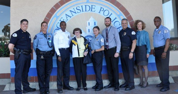 left to right: OPD Capt. Marchand, MiraCosta PSO Jessica Taft, OPD Police Cadet Charles Dabney, Maria Grant, OPD Explorer Julen Payo, Detective Ryan Malone, OPD Lt. Lopez, MiraCosta College Foundation Associate Director Elaine Dodge, and OPD CSO Forrest Baxter (photo courtesy: OPD)