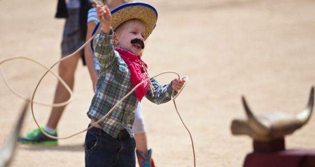 Gavin, 5 tries his hand at roping during the 2016, Wild West Fest in Carlsbad