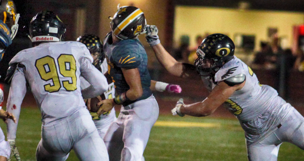 El Camino QB Jaden Casey has his head twisted when Dayne Tu'ikolongahau Fehoko grabs his face mask. The infraction was ruled incidental contact with the face mask for a 5 yard penalty.