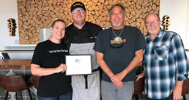 That Boy Good! owners Miss Kim and Chef Mark, along with the Senior Anglers' Social Chairperson Greg Thompson, and Ken Harrison