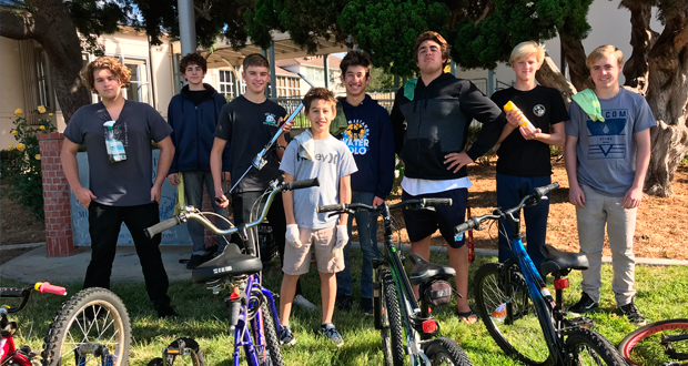 Members+of+the+San+Dieguito+Academy+Boys+Water+Polo+Team+at+their+Bike+Drive+benefitting+the+Encinitas+Community+Resource+Center%E2%80%99s+Holiday+Baskets+event.+From+L-R%3A+Jude+Irons%2C+Eli+Anderson%2C+Alex+Glenn%2C+Ben+Wieland%2C+Michael+Wieland%2C+Matheus+Gensler%2C+Vinnie+Whibbs+and+Blake+Brandley.+%28Courtesy+photo%29