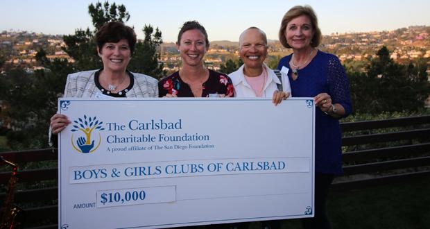 (left to right) The San Diego Foundation Incoming Board Chair P. Kay Coleman, Boys & Girls Club of Carlsbad Teen Director Liz Hopley, The San Diego Foundation Board Member Donna Marie Robinson, and Carlsbad Charitable Foundation Board Chair Sandy Lund pose for a photo as the Carlsbad Charitable Foundation presents a grant check to the Boys & Girls Club. (Photo courtesy: Carlsbad Charitable Foundation)