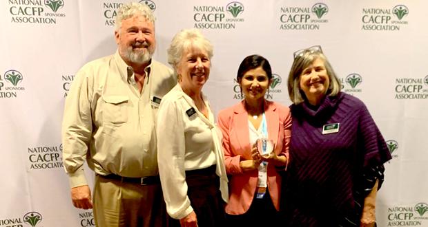 Hunger Free Kids Director, Paloma Perez Bertrand, accepting the award last week at the national CACFP conference in Chicago, Ill. (Second from the right, holding the award) Courtesy photo