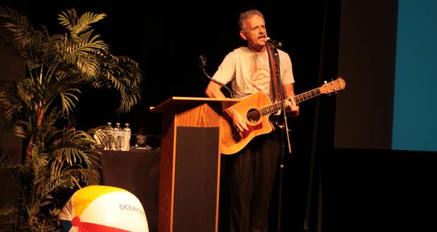 Oceanside Mayor Peter Weiss kicks off Visit Oceanside’s ninth annual Tourism Summit with a song at the Brooks Theatre