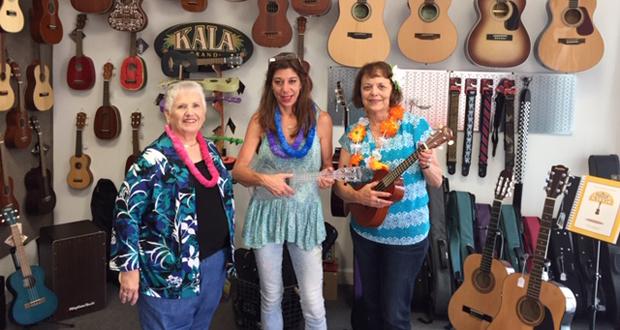 Two ukuleles will be raffled off at the luau along with lessons donated by Giacoletti's Music and the Sunset Strummers Ohana Ukulele Band.l-rJoyce Cerimeli co-president/chair of the Brother Benno's Auxiliary luau, Stephanie Stevens of Giacoletti's Music and Linda Donahue co-chair of luau. (courtesy photo)