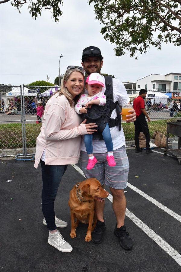 Ashley and Nick Adkins with their daughter, Everley, enjoy a break in the beer garden at the Encinitas Spring Street Fair on April 10. (Photo by Charlene Pulsonetti)