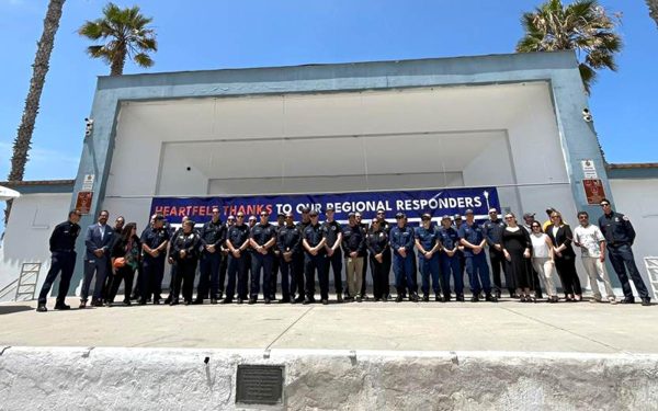 Oceanside officials stand with members of area firefighting and law enforcement agencies and others on June 26 who helped fight the Oceanside Pier fire in late April. The event was held at the pier’s amphitheater. (Courtesy photo)