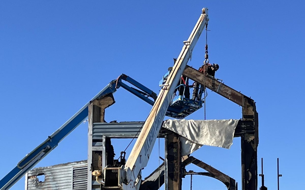 The fire-damaged frame of the former Ruby’s Diner at the end of Oceanside Pier is dismantled Oct. 23. (Oceanside city photo)